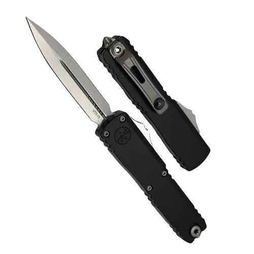 Black folding knife with a silver blade on a light gray background