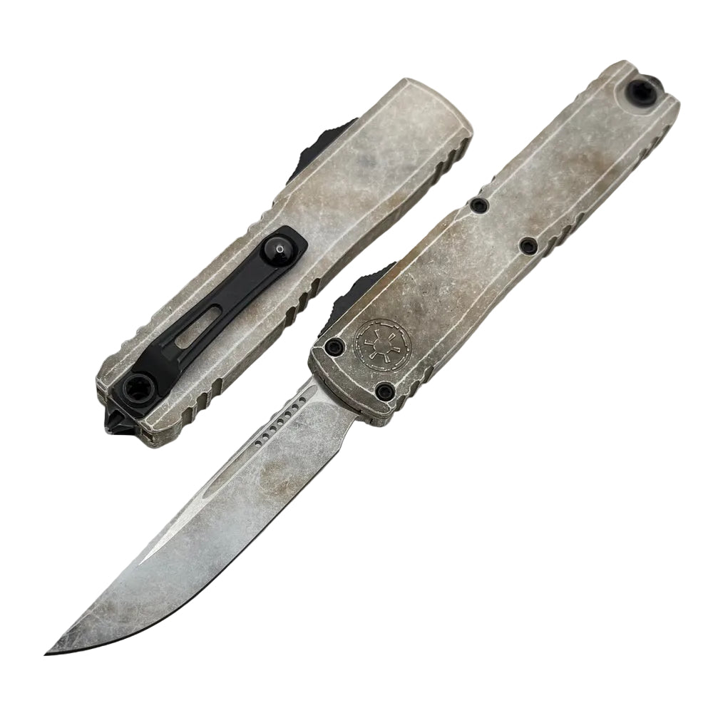Folding knife with a metallic finish on a white background