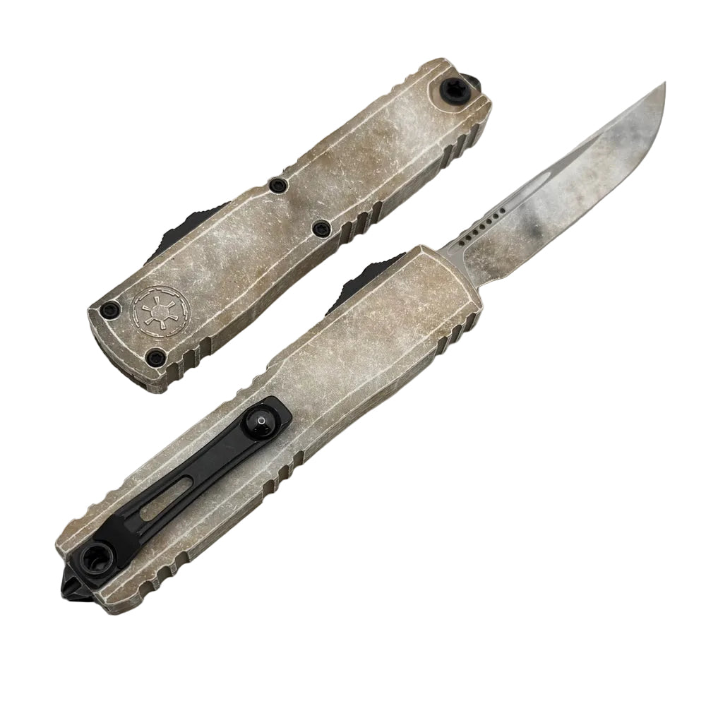 Folding knife with a metallic finish on a white background