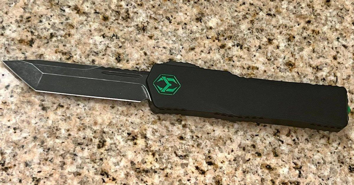 Heretic Knives Colossus T/E Blade Show '23 Black Slab Handle w/ Deep Engraved Heretic Green Logo Battle Black Blade - NORTH RIVER OUTDOORS