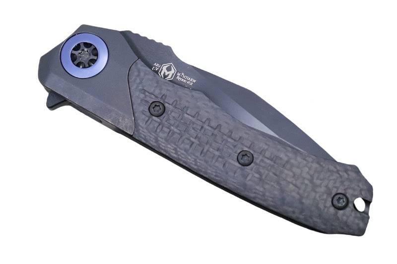Heretic Wraith Manual Flipper Knife 3.625" CPM-MagnaCut Black DLC Battle Worn Clip Point Combo Integral Battle Worn DLC Titanium Handle Carbon Fiber Serrated - NORTH RIVER OUTDOORS