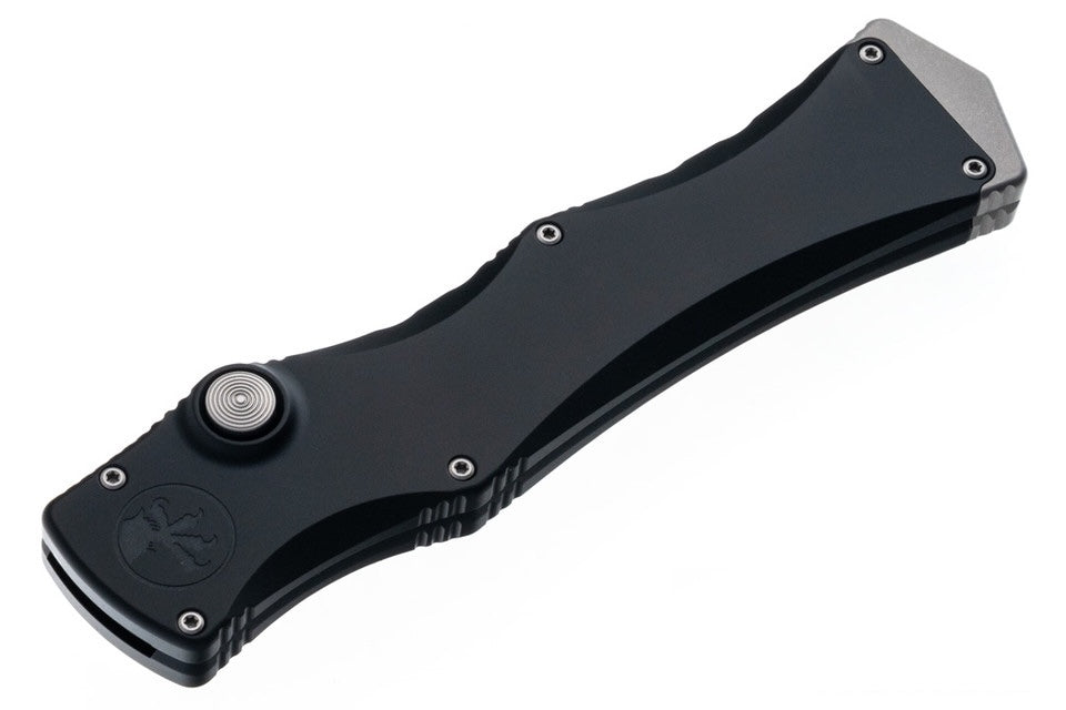 Black folding knife on a white background