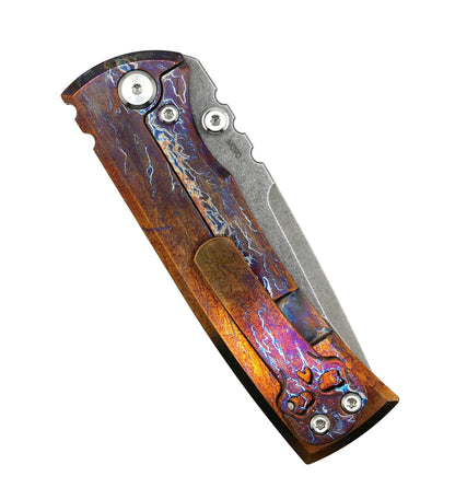 Folding knife with a decorative wooden handle on a white background