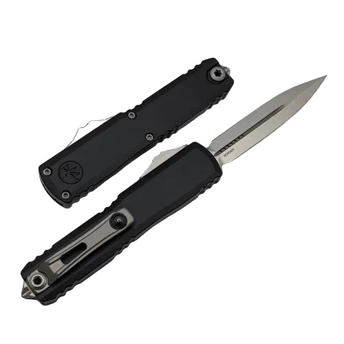 Black folding knife with a silver blade on a light gray background