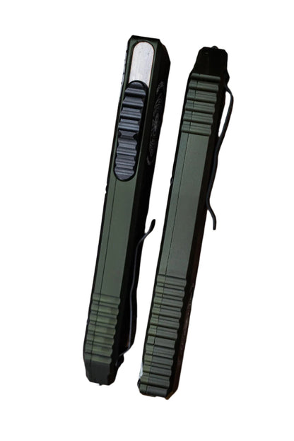 Two black tactical pens on a wooden surface