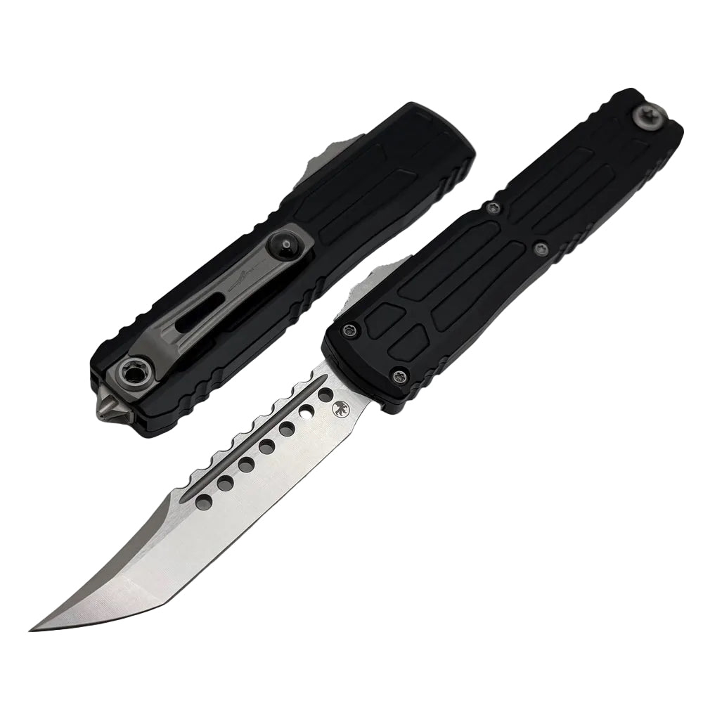 Black folding knife with a metallic blade on a light gray background