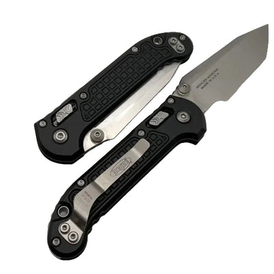 Two folding knives on a light gray background