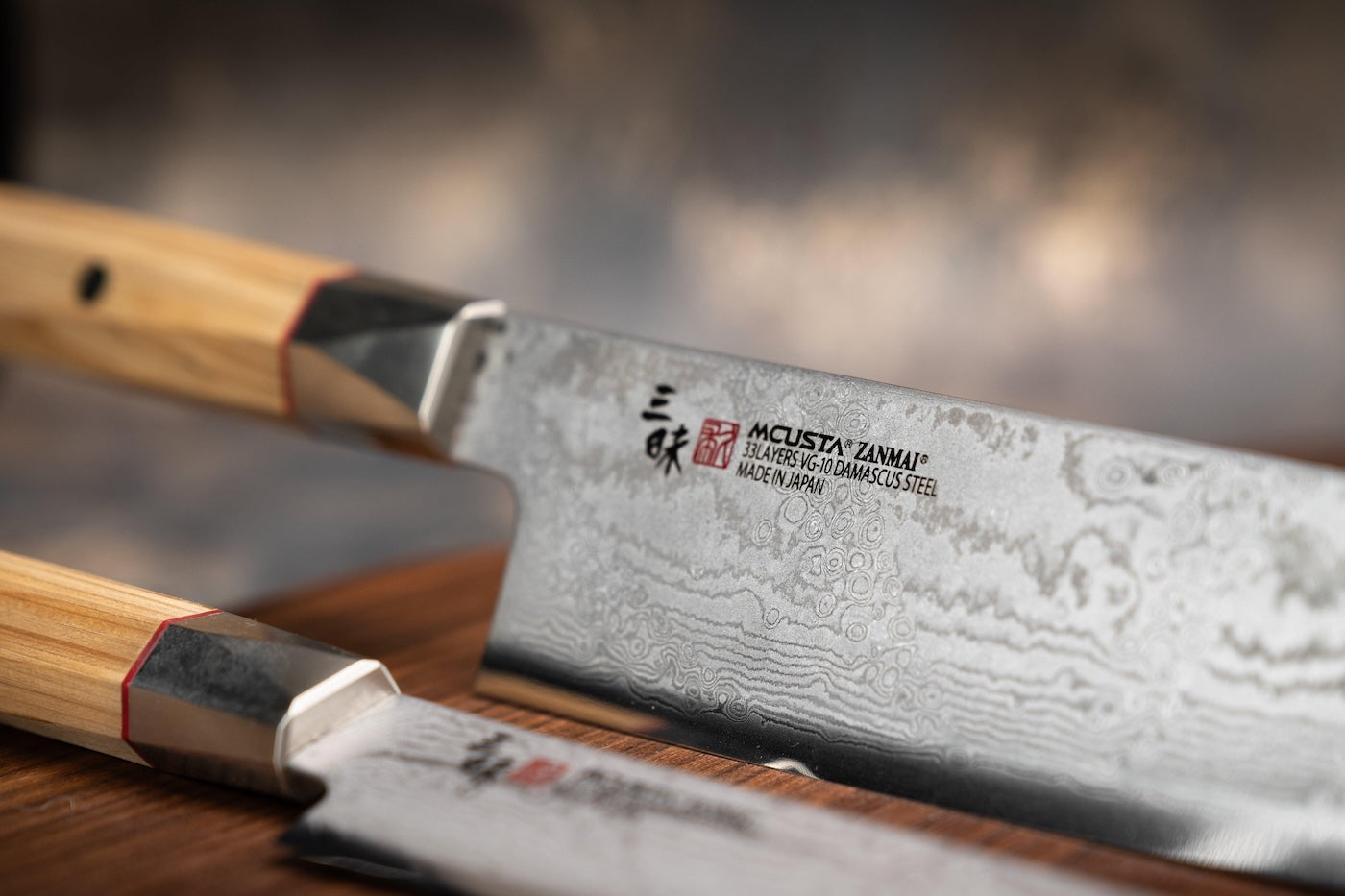 Set of knives with a focus on a branded knife on a blurred background