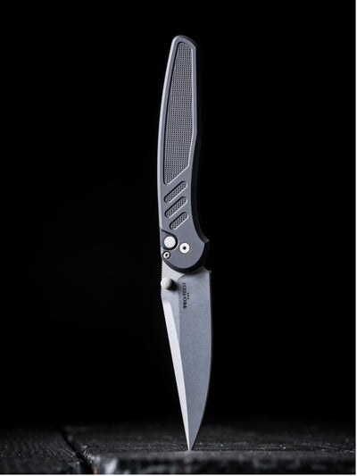 Folding knife with a textured handle on a black background