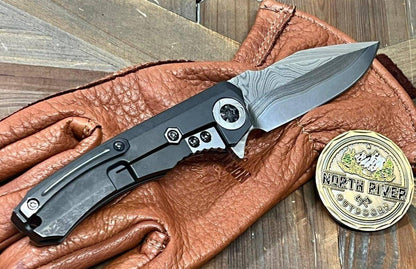 Heretic Knives Custom Wraith Manual T/E DLC Titanium Handle w/ Vegas Forge Wood Grain Damascus Inlay Hand Compound Ground Vegas Forge Wood Grain San Mai Damascus Blade - NORTH RIVER OUTDOORS