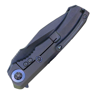 Heretic Wraith Manual Flipper Knife 3.625" CPM-MagnaCut Black DLC Battle Worn Clip Point Combo Integral Battle Worn DLC Titanium Handle Carbon Fiber Serrated - NORTH RIVER OUTDOORS