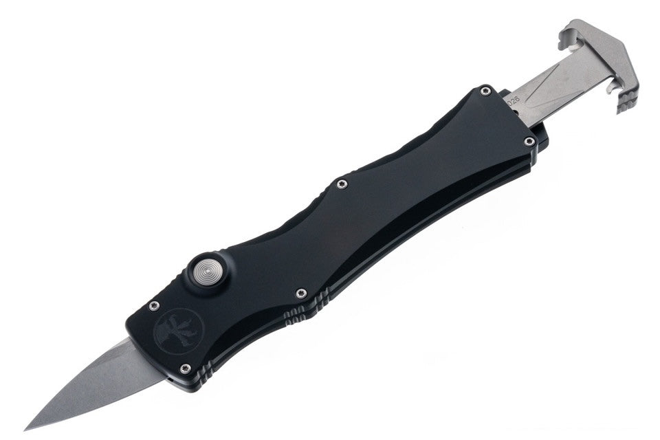 Black folding knife with a silver blade on a white background